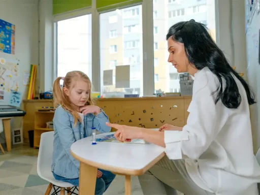 Speech therapist working with a young child during a language assessment.
