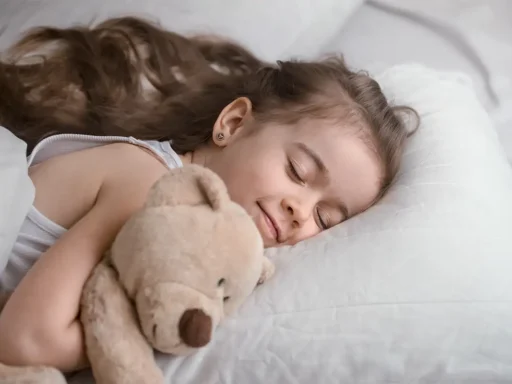 A cute toddler in bed sleeping with teddy